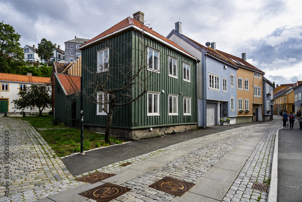 Trondheim Bakklandet district is full of small colorful houses and typical cobbled streets.