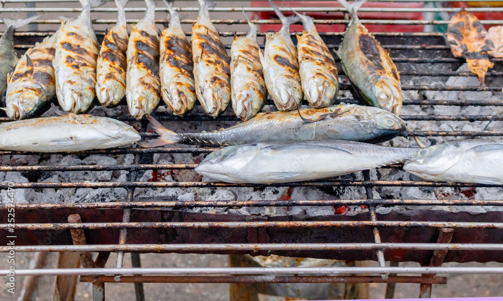thai style grilled fish on the fire stove waiting for customer