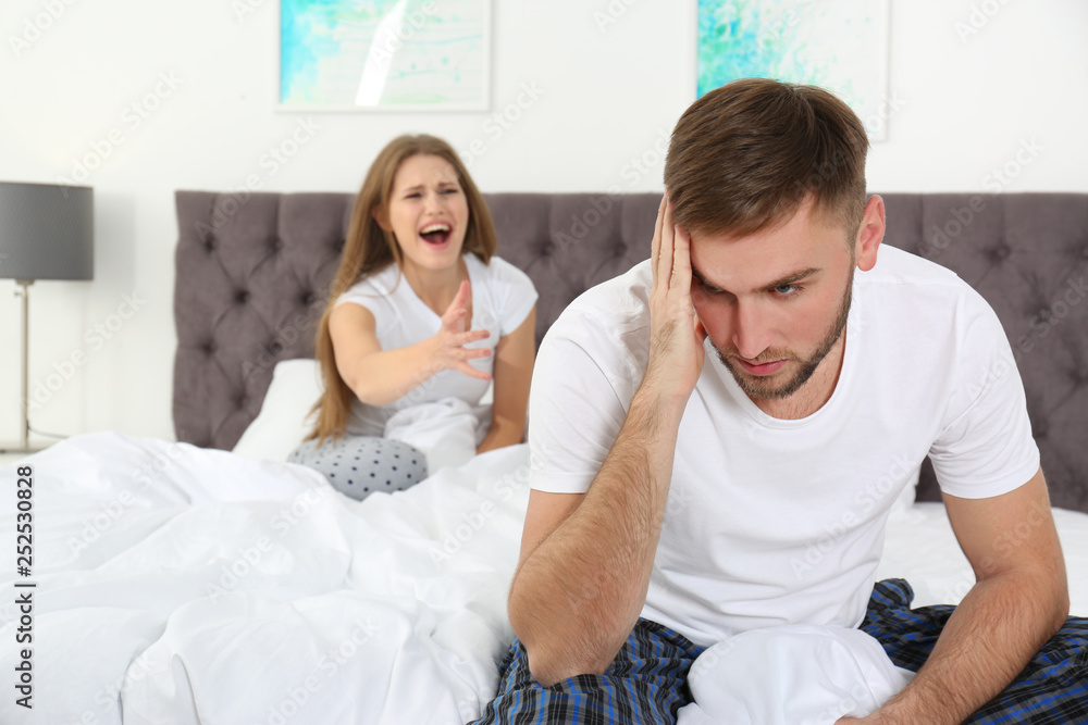 Young couple arguing in bedroom. Relationship problems Young couple arguing in bedroom. Relationship problems