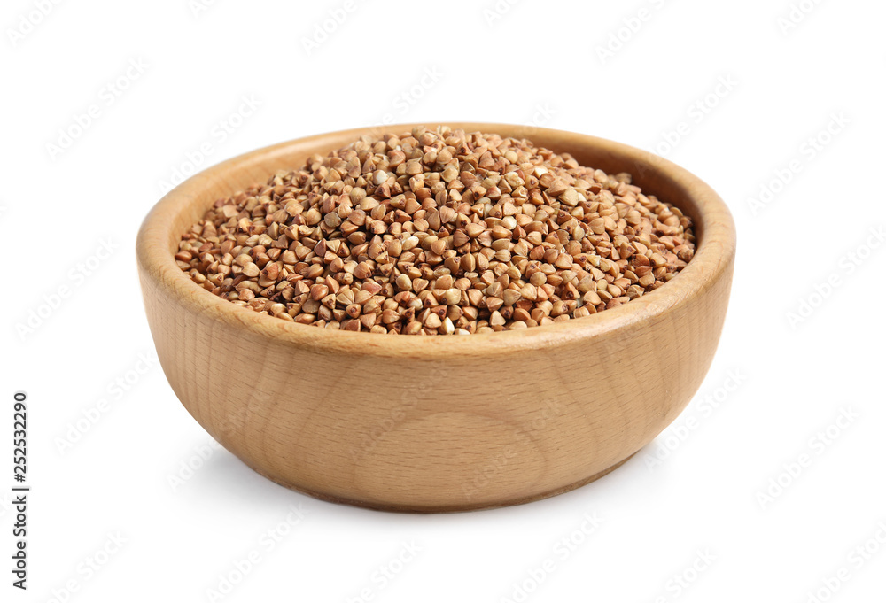 Bowl with uncooked buckwheat on white background Bowl with uncooked buckwheat on white background