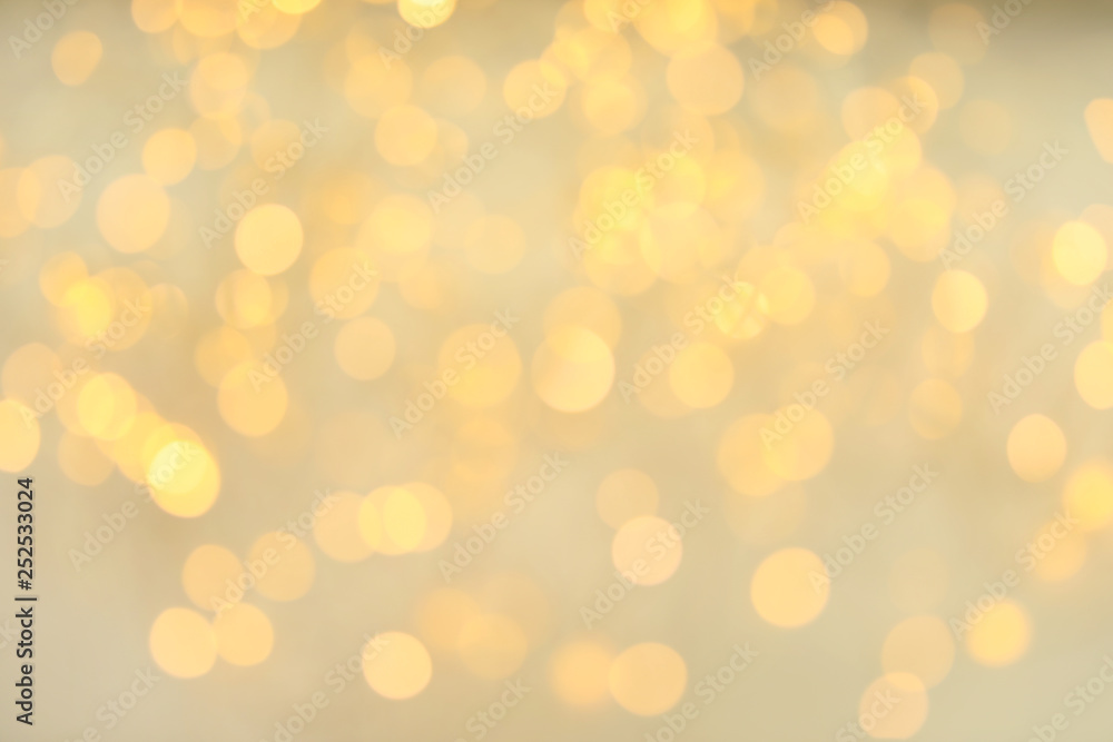 Obraz premium Złoty brokat z efektem bokeh na jasnym tle