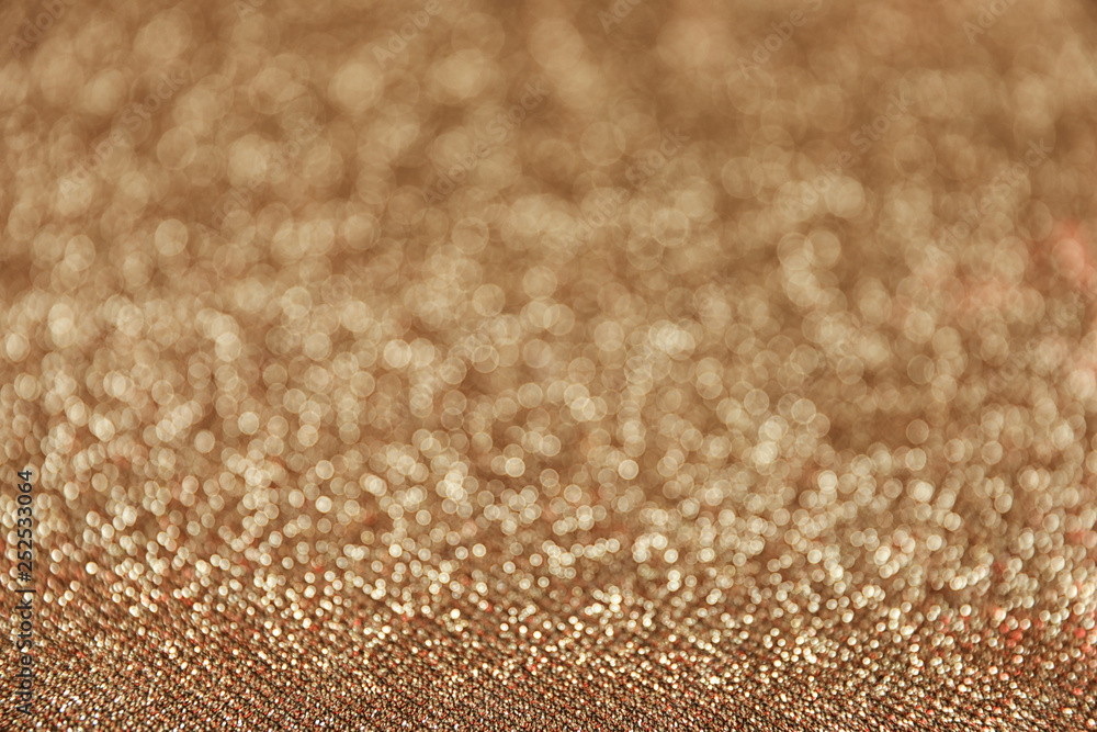 Gold glitter with bokeh effect as background, closeup Gold glitter with bokeh effect as background, closeup