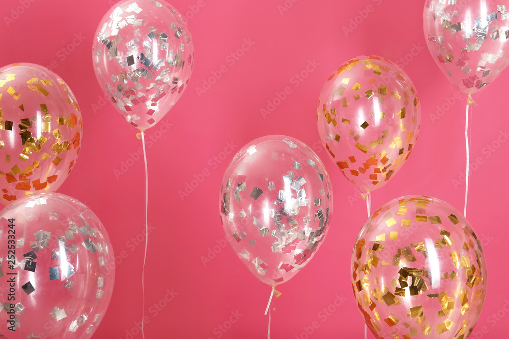 Bright balloons with sparkles on color background Bright balloons with sparkles on color background