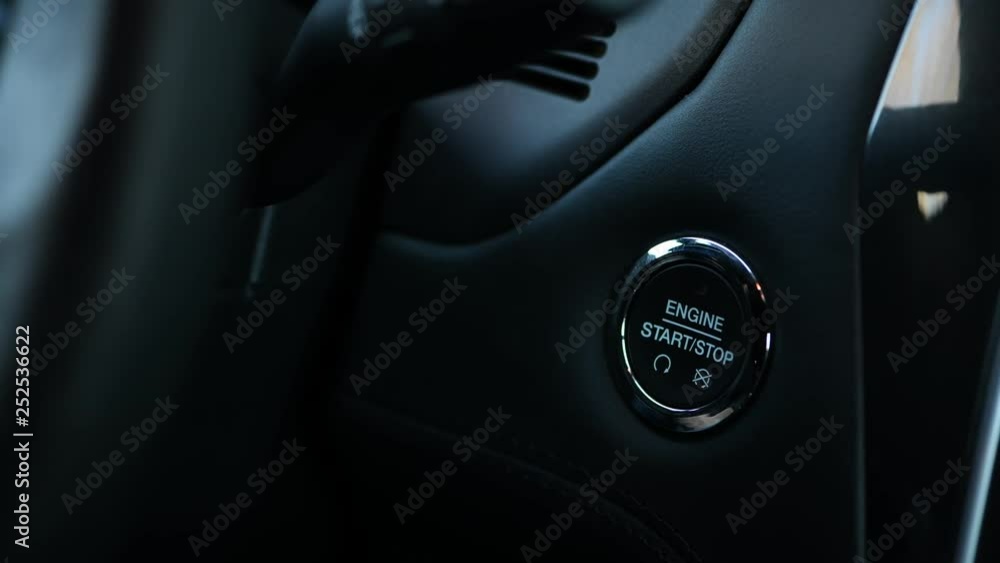 Car driver starting the engine and stopping the engine of a car at night Car driver starting the engine and stopping the engine of a car at night