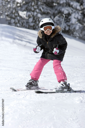 A Young Girl Snow Skiing