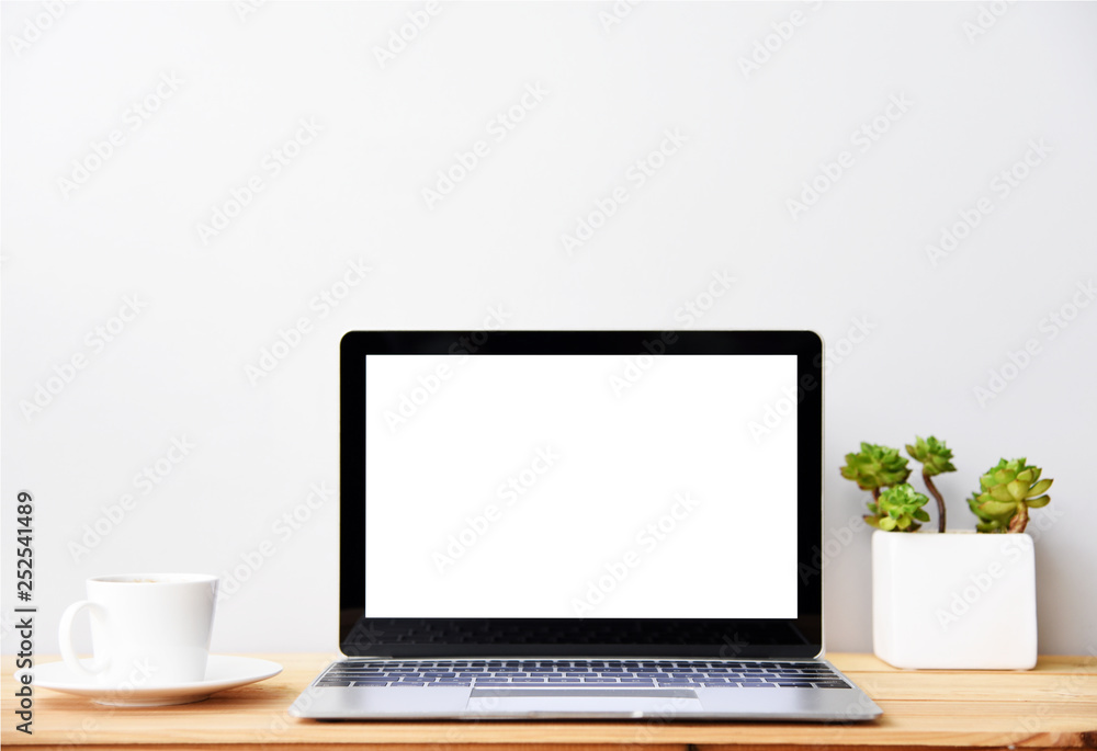 blank screen Modern laptop computer with mouse,Smart phone and Succulent on wood table in office view backgrounds blank screen Modern laptop computer with mouse,Smart phone and Succulent on wood table in office view backgrounds