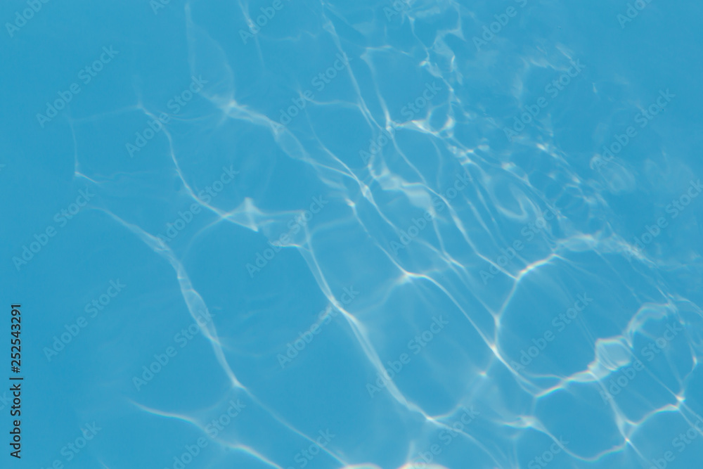 Blue pool water with sun reflections Blue pool water with sun reflections