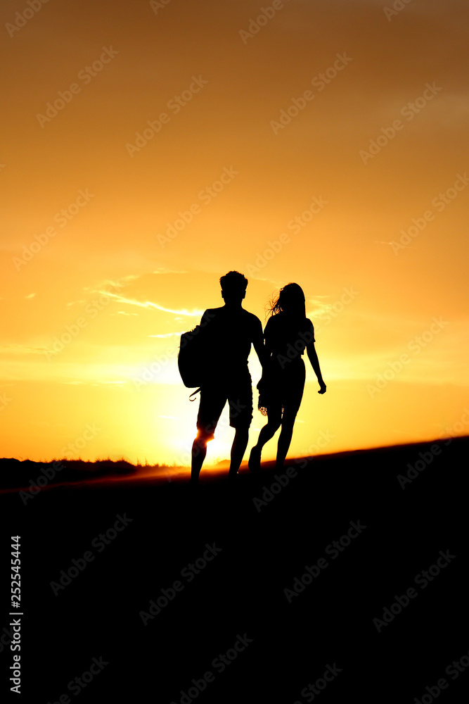 Romantic adventure couple sunset