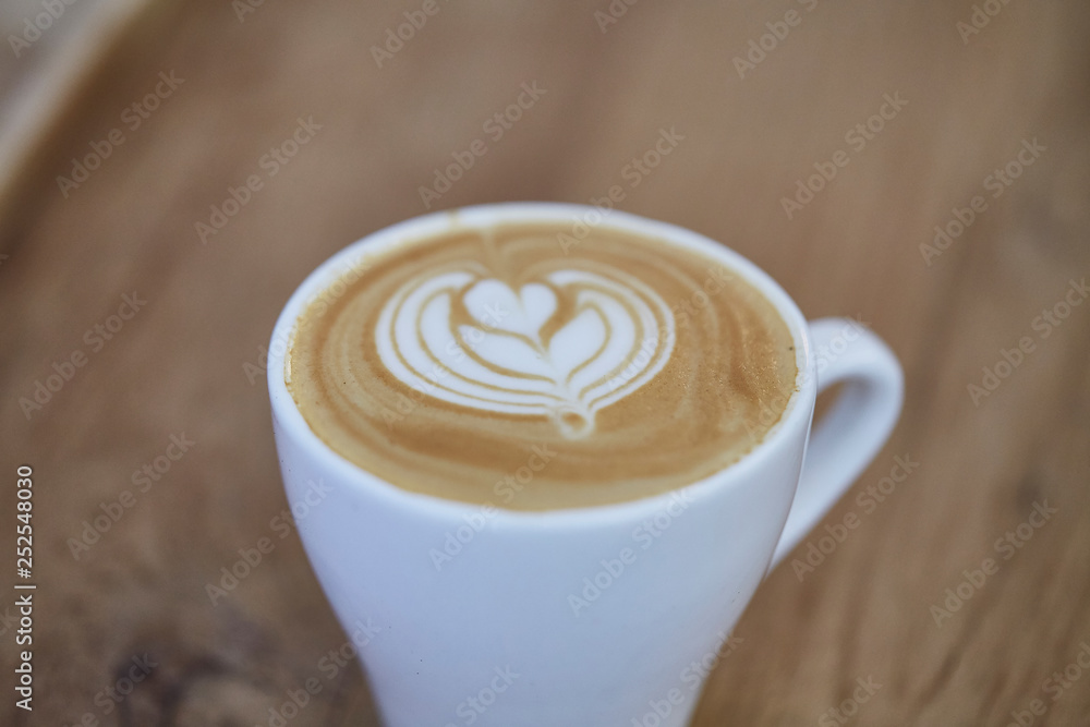 Art in coffee cup. Close up over view of art on coffee toppings . Selective focus Art in coffee cup. Close up over view of art on coffee toppings . Selective focus