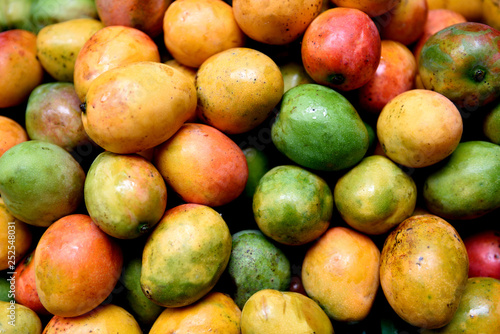 Colorful ripe mangoes, farmers produce market, Colombia