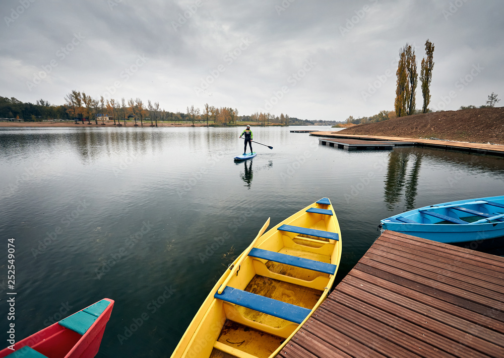 Man on stand up paddleboard Man on stand up paddleboard