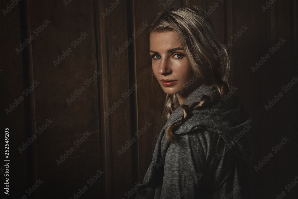 Fototapeta premium Blonde against old wooden