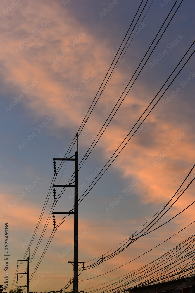 pylon electricity power line with sunset sky background