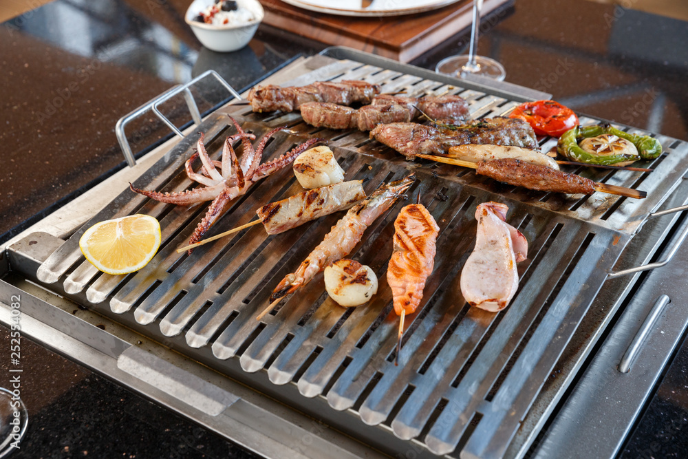 seafood and meat on grill