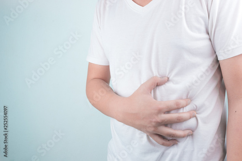 Wallpaper Mural Asian Young men are suffering from stomach ulcers. gastritis Caused by the infection of H. pylori bacteria  healthcare and health problem concept Torontodigital.ca