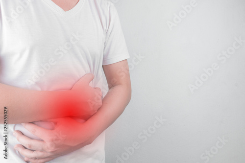 Wallpaper Mural Asian Young men are suffering from stomach ulcers. gastritis Caused by the infection of H. pylori bacteria  healthcare and health problem concept Torontodigital.ca