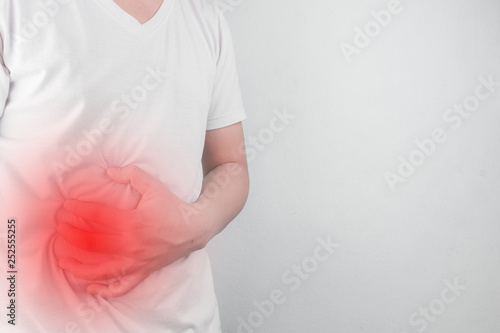 Wallpaper Mural Asian Young men are suffering from stomach ulcers. gastritis Caused by the infection of H. pylori bacteria  healthcare and health problem concept Torontodigital.ca