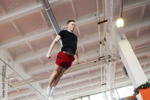Young man jumping on a trampoline.