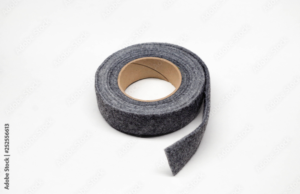 Roll of gray felt weather-strip for eliminating air, dust and moisture leaks around doors and windows Roll of gray felt weather-strip for eliminating air, dust and moisture leaks around doors and windows