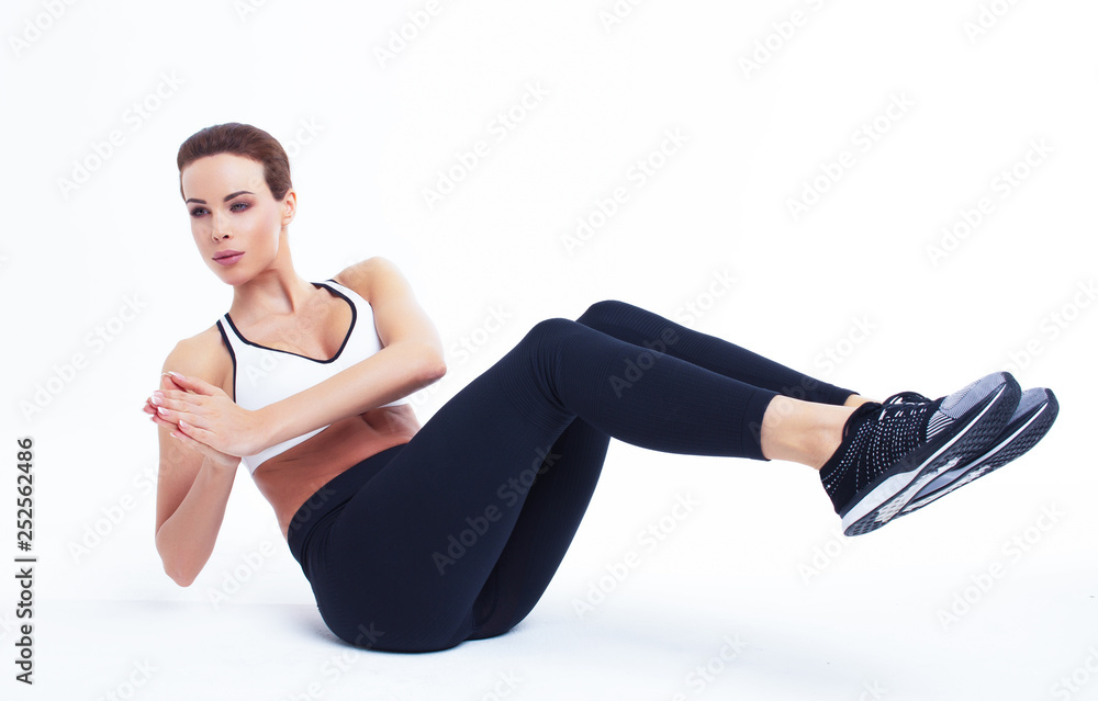 Young fit woman doing russian twist exercise - obrazy, fototapety, plakaty 