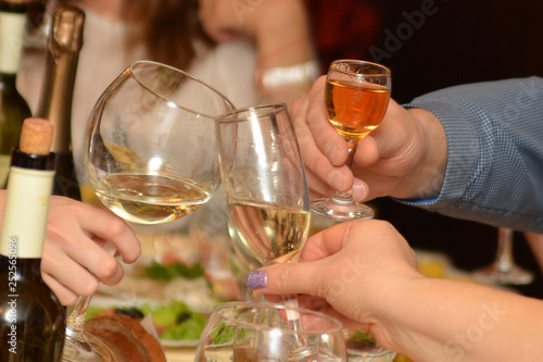 Glasses of champagne in female and male hands on a party