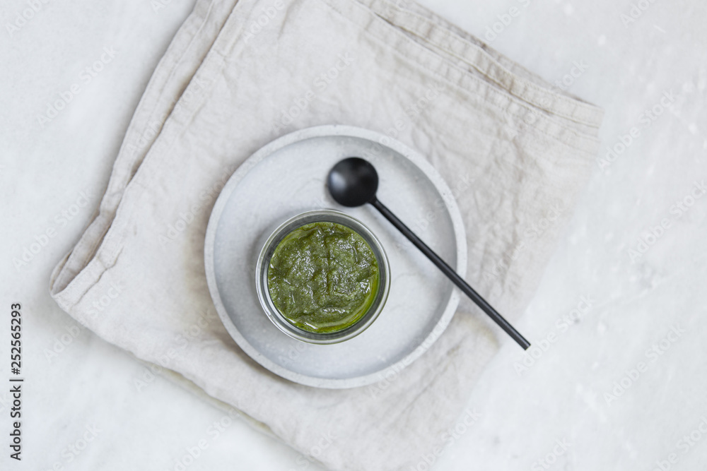 fresh pesto in bowl on marble texture background with copy space fresh pesto in bowl on marble texture background with copy space