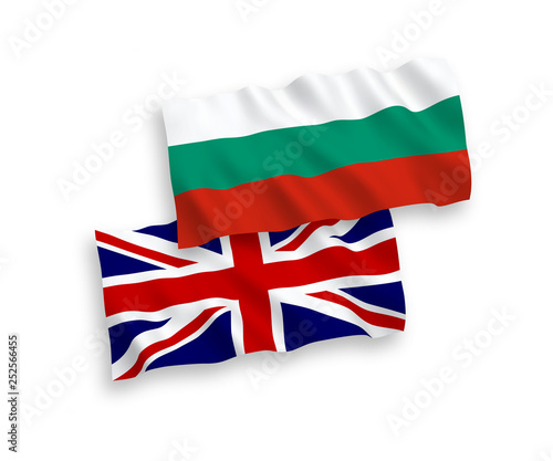 National vector fabric wave flags of Bulgaria and Great Britain isolated on white background. 1 to 2 proportion.