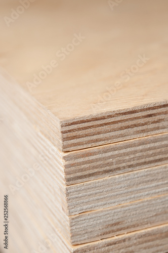 Plywood stacked in a pile.