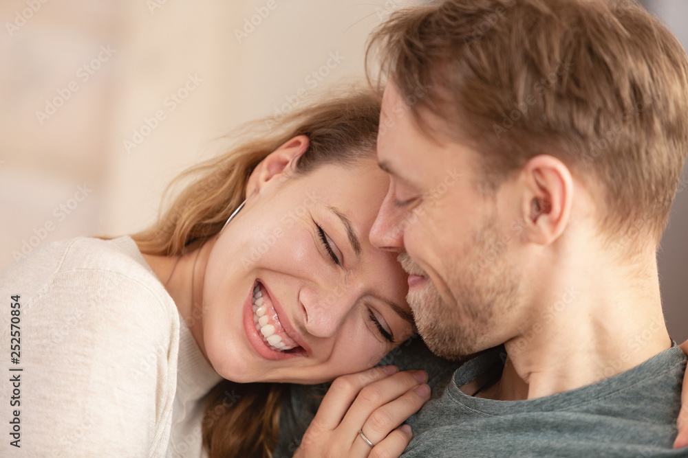 Close up - portrait of happy newlyweds charming positive girl and nice guy enjoying chatting with each other during honeymoon Close up - portrait of happy newlyweds charming positive girl and nice guy enjoying chatting with each other during honeymoon