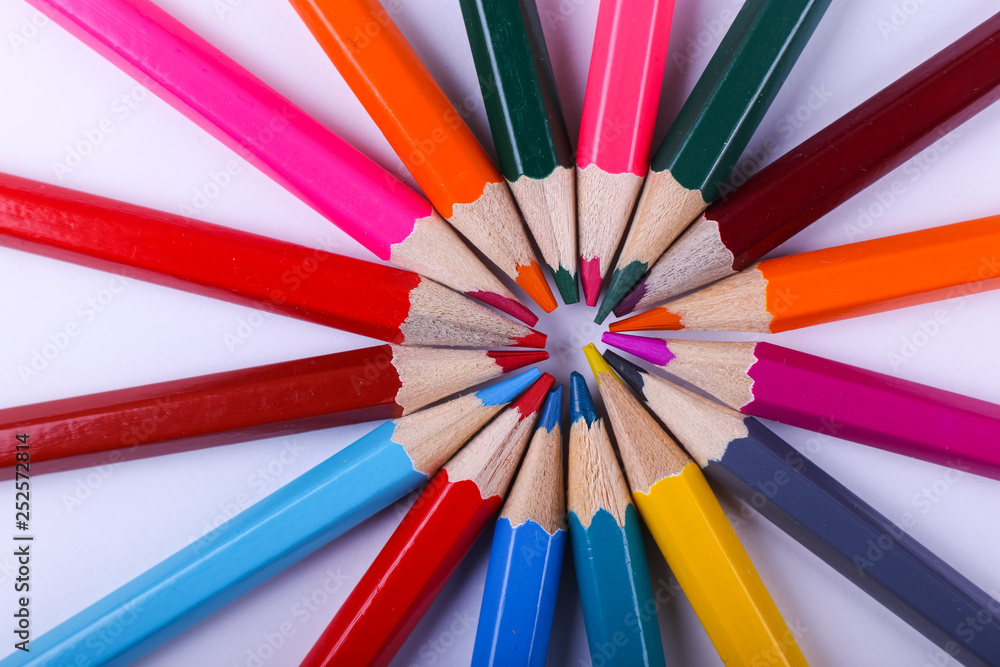 Fototapeta premium Colored pencils, school supplies for drawing, pattern, copy space.