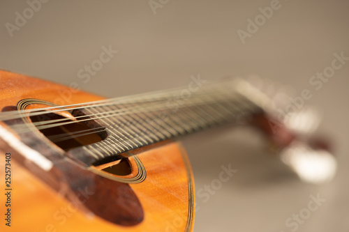  Mandolin in flashlight on gray background. photo