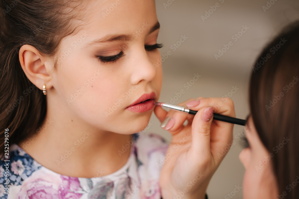 Make up for little princess. Beautiful little girl prepare for a photosession. Hairstyle Make up for little princess. Beautiful little girl prepare for a photosession. Hairstyle