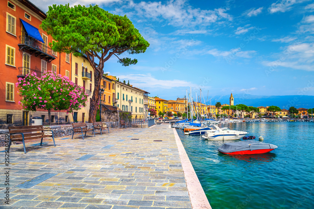 Promenade with colorful mediterranean oleander flowers, Toscolano-Maderno, Italy - obrazy, fototapety, plakaty 