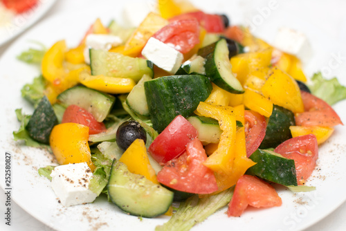 fresh vegetable salad, greek salad on white background.