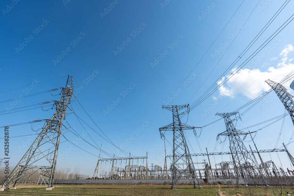 electricity pylons in field