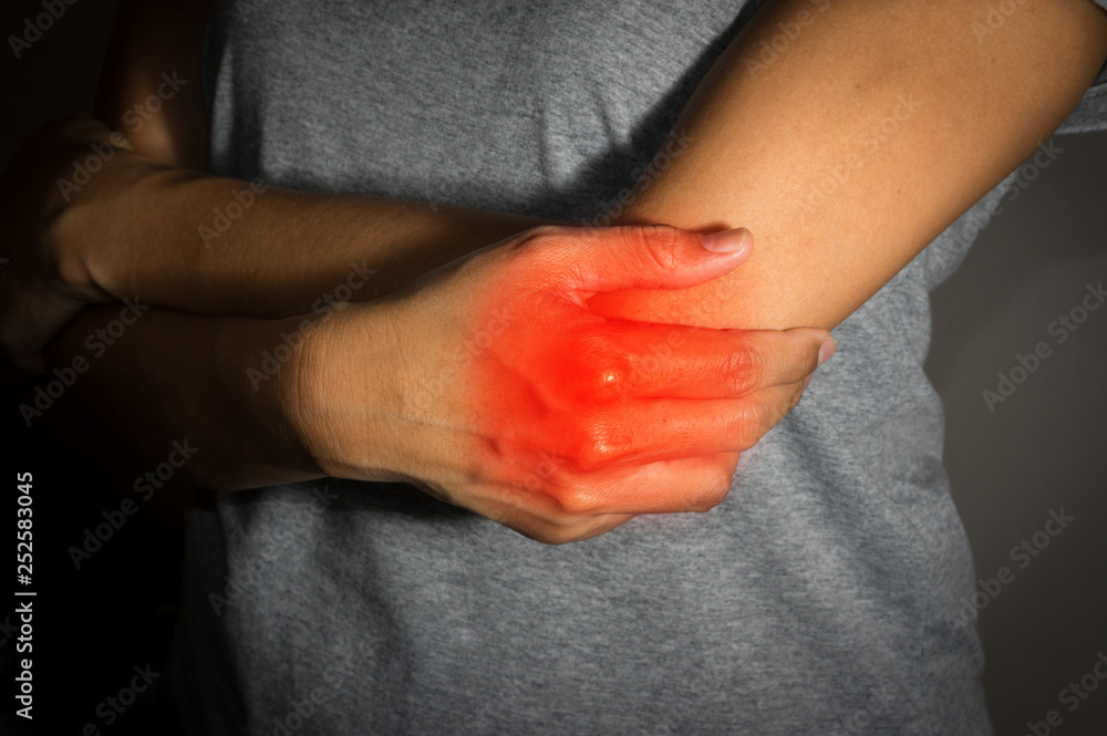 Female suffering from elbow pain.