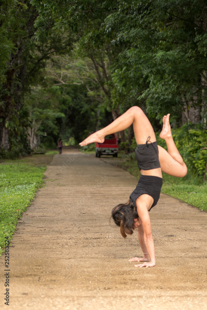 Filipino girl yoga posing in tropical jungle rice fields Filipino girl yoga posing in tropical jungle rice fields