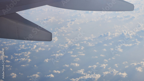 Above the clouds.Wing aircraft on the sky