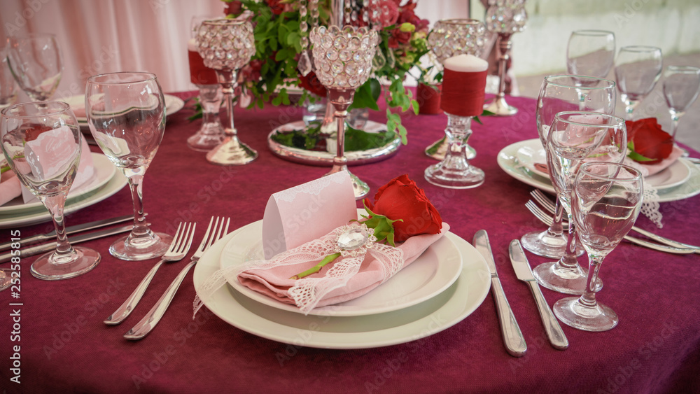 festive table decoration with red flowers