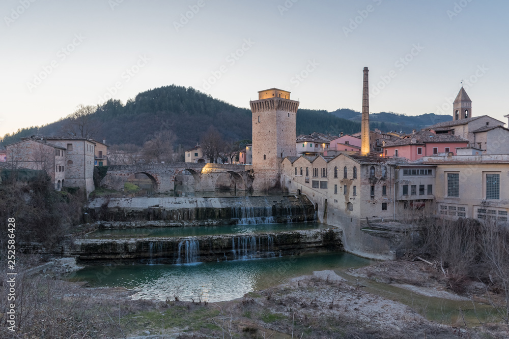View of the historic centre of Fermignano (Pesaro-Urbino province) with the roman bridge over the Metauro river