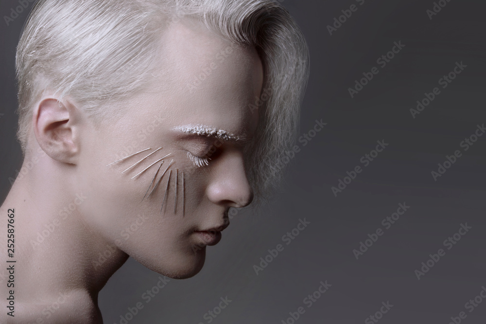 Elegant stylish handsome man. Studio fashion male model art portrait. Vogue model, creative makeup