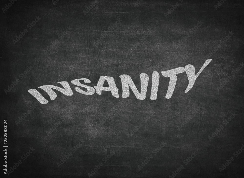 Obraz premium Insanity concept word on a blackboard background