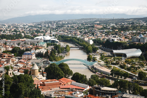 Tbilisi city panorama. Old city  new Summer Rike park  river Kura  the European Square and the Bridge of Peace