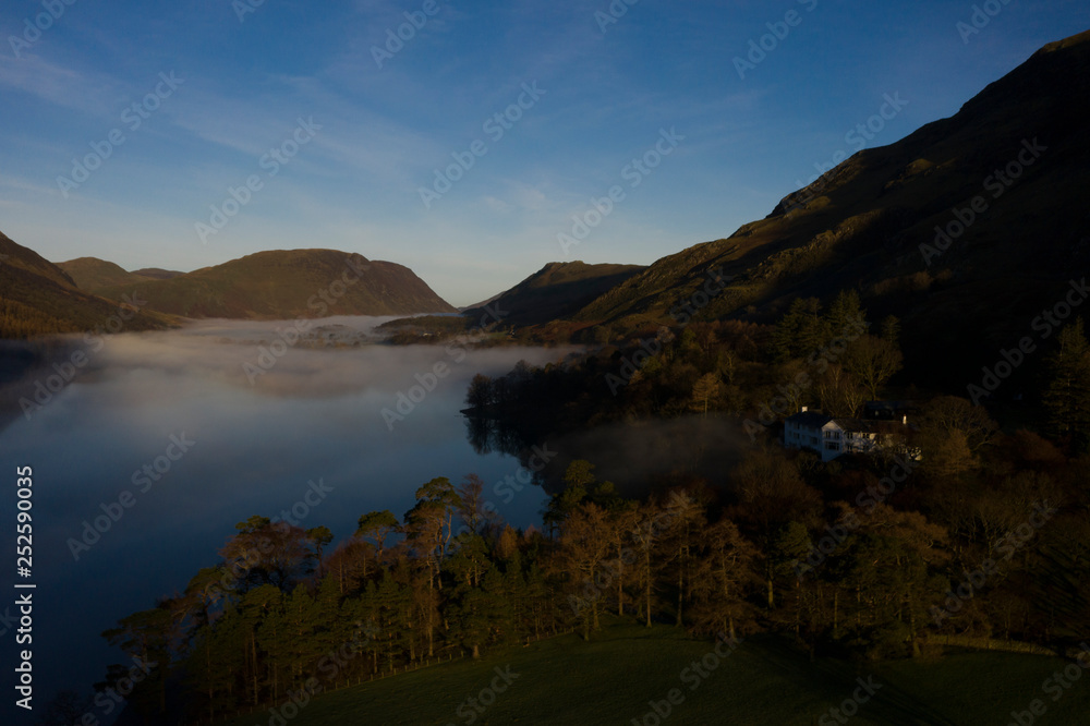 sunrise over trees on the eastern side of Buttermere, The Lake Distict,UK