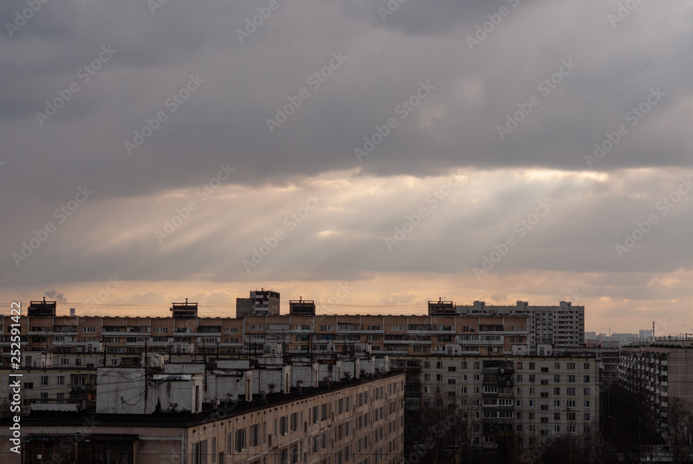 God rays (crepuscular rays) over the residential buildings