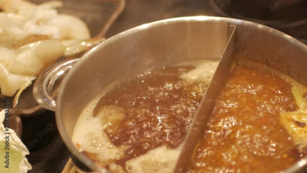 Close up into the shabu shabu pot while boiling -Japanese/Chinese food Close up into the shabu shabu pot while boiling -Japanese/Chinese food