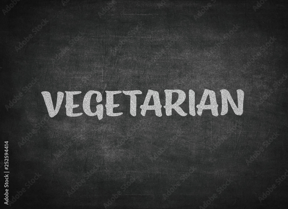 Obraz premium vegetarian concept word on a blackboard background