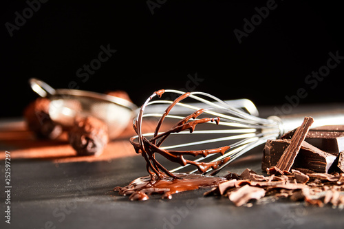Preparing chocolate bonbons with an old whisk