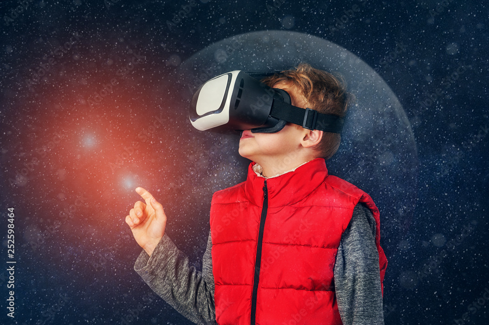 Virtual world of technology. A child plays in a virtual reality Virtual world of technology. A child plays in a virtual reality