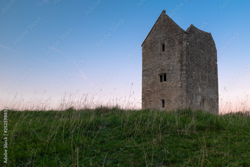 Fototapeta premium The grade II listed Dovecote Tower at Bruton in Somerset shot at sunset
